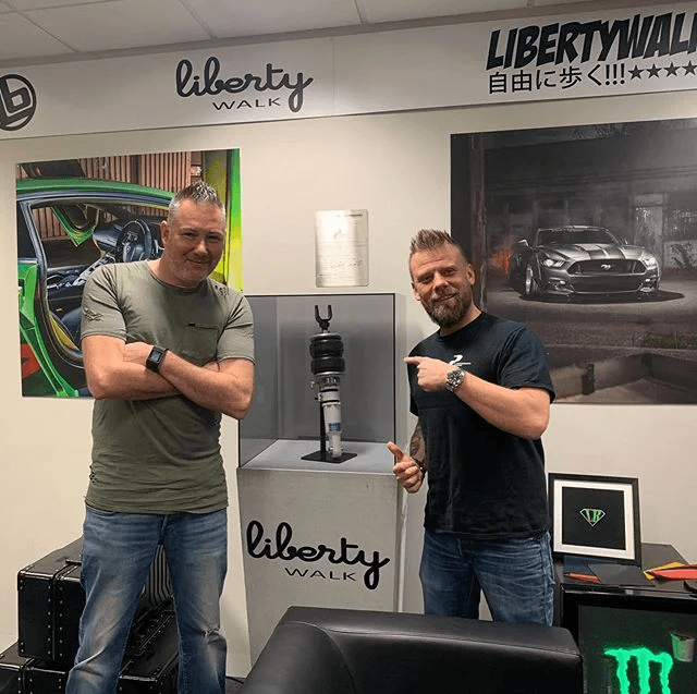 Rob and a client beside a bespoke feature plinth built by PaceDisplay